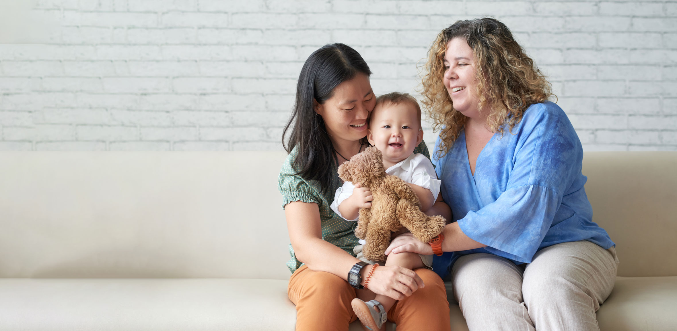diverse-lesbian-couple-sitting-with-child-2021-09-03-17-21-36-utc-CTA.jpg