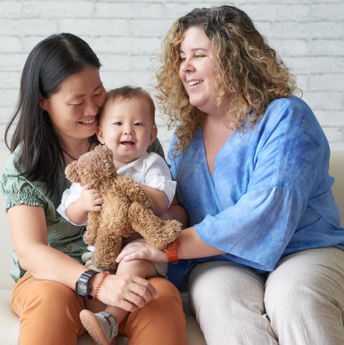 diverse-lesbian-couple-sitting-with-child-2021-09-03-17-21-36-utc.jpg